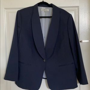Navy blazer with front pockets and single button.